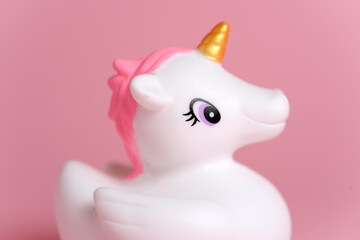Close-up unicorn dreaming isolated on pink