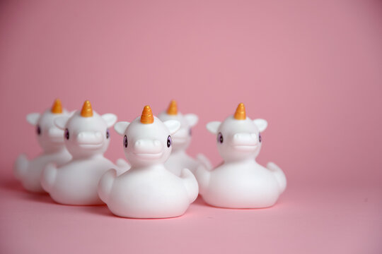 A Flock Of Unicorns Isolated On Pink