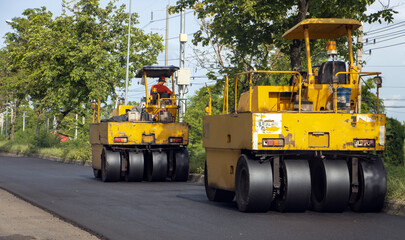 Road rollers are working on the construction of the motorway