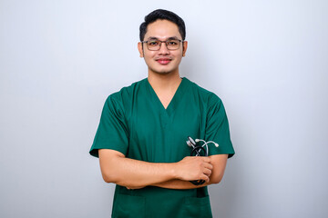 Professional good-looking asian doctor, medical worker in glasses and scrubs, cross arms and smiling