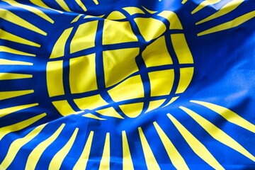 Closeup shot of deep tones of the ruffled flag of Commonwealth Symbol Visual Identity