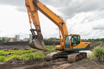 Crawler excavator digs the earth with a bucket.  Excavators are used when working in quarries and mine workings. Peat mining. Drainage of swamps.