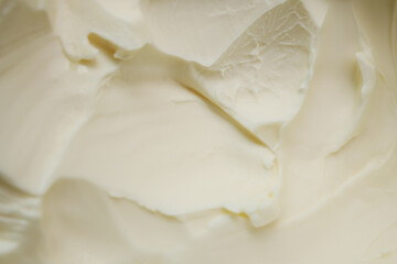 close up of fresh butter in a container 