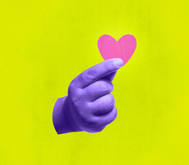 Hand holding a heart symbol. Giving love and care. Collage style with colorful pop art.