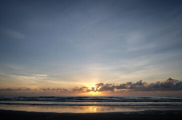An early morning sunrise at the beach.