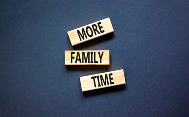 More family time and support symbol. Concept words More family time on wooden blocks. Beautiful black table black background. Business, more family time qoute concept. Copy space.