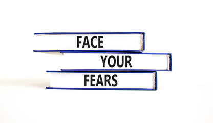 Face your fears and support symbol. Concept words Face your fears on books. Beautiful white table...