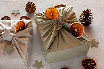 Christmas gifts textile packed, decorated with natural materials, zero waste