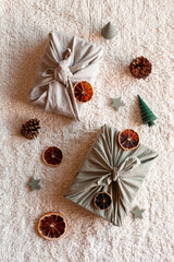 Christmas gifts textile packed, decorated with natural materials, zero waste