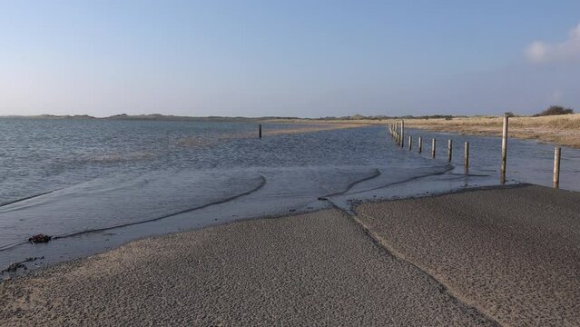 Holy Island of lindisfarne as tide comes in North of England. Vacation places UK 4K