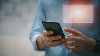 Hands of a man using a smartphone to stream online watch video on the internet Your tutorials to stream online. Watch videos on the Internet, live shows, shows, or tutorials.