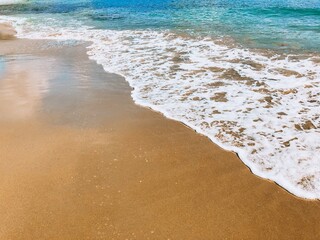 Sea beach foam and blue sea. Concept background beach vacation and tourism