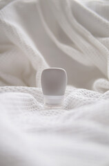 lotion tube mockup isolated on white fabric background.
