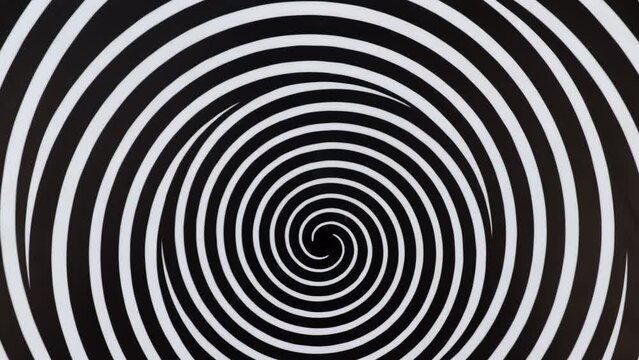 Rotating spirals optical illusion, dizzy concentric circles pattern hypnotic abstract made from three real boards painted in black and white circling lines.