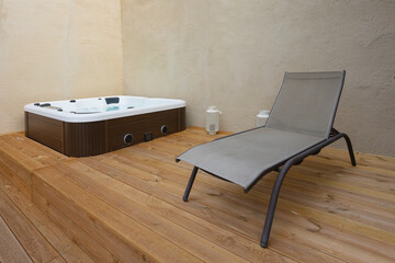 Jacuzzi and deck chair on wooden floor - obrazy, fototapety, plakaty