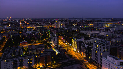 Aerial view of night city. Twilight aerial cityscape