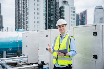 An engineer's portrait is examining the cooling tower air conditioner of a huge industrial building to control airflow.