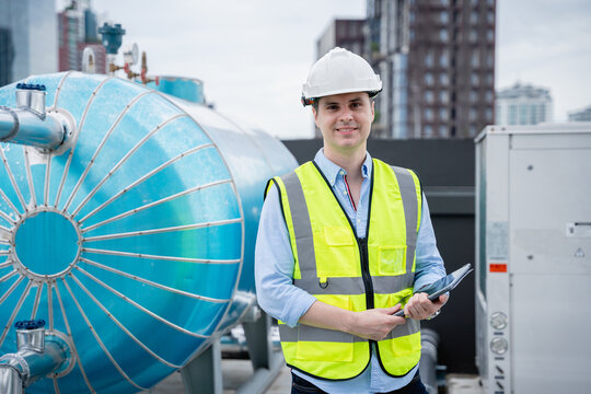 A Team Of Engineers Is Checking The Air Conditioning Cooling System Of A Major Building Or Industrial Facility.