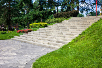 concrete steps in a landscape recreation park with bushes