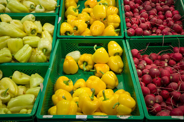 bell peppers on the counter in the supermarket