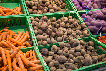 fresh red beets on the counter, vegetables in the supermarket