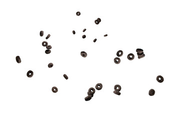 Chocolate rings cereal spill out into a bowl. Breakfast.