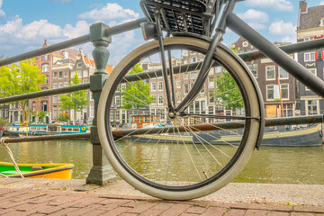 Amsterdam Canal Embankment and Bicycle Wheel