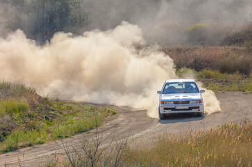 Sports Car on the Turn of the Rally Track and a Lot of Dust 10