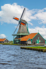 Dutch Windmill on the Bank of the Canal