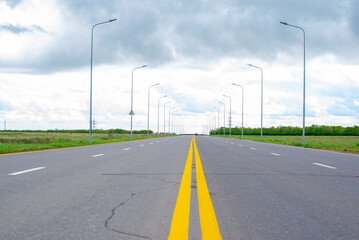 road perspective of paved and sky before rain
