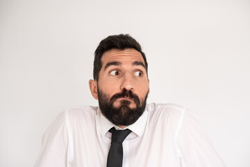 Amusing bearded man making funny face. Male model in tie fooling around. Portrait, emotion concept