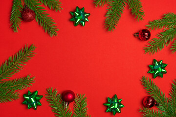 Set of festive, fir tree and Christmas decorations on colourful background. Top view of New Year ornament concept with copy space.