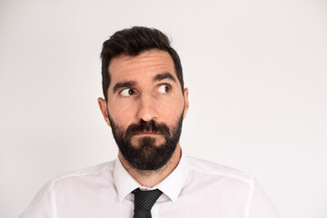 Bearded man making funny face. Male model in suit fooling around. Portrait, emotion concept