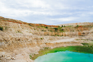 Lake formation in an old abandoned quarry. Quarry lake.