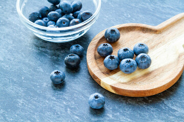 Blueberries on a wooden table. Fresh berries. Wild blueberries on a wooden stand