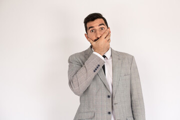 Portrait of surprised bearded man. Male in suit gesturing with surprise. Portrait, emotion concept