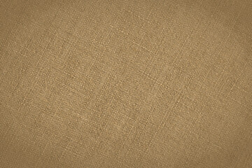 Fototapeta na wymiar Light brown woven surface closeup. Linen textile texture. Fabric sewing background. Textured braided backdrop. Len wallpaper with vignetting. Macro