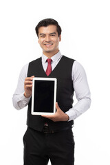 Portrait young businessman working on new tablet, mobile phone in white studio. Portrait of a confident business man in black suit feeling happy and smile holding tablet or mobile phone.