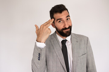 Portrait of expressive bearded man. Male in suit gesturing, touching temple. Portrait, emotion concept