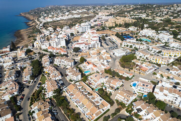Fototapeta na wymiar Drone Aerial Above Houses With Pools Praia Da Luz Lagos Portugal Algarve