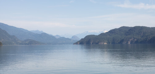 Harrison Lake during Sunny Summer Morning. Canadian Nature Landscape Background. Harrison Hot Springs, British Columbia, Canada.