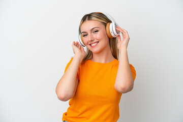 Young caucasian woman isolated on white background listening music