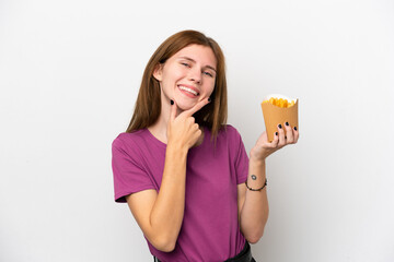 Young English woman holding fried chips isolated on white background happy and smiling