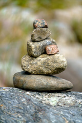 Pyramid of stones. Unstable balance of stone objects. Idyllic state of nature.