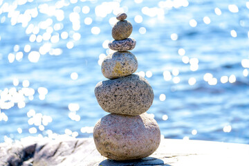 Pyramid of stones. Unstable balance of stone objects. Idyllic state of nature.