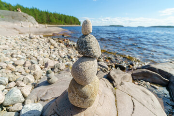 Pyramid of stones. Unstable balance of stone objects. Idyllic state of nature.