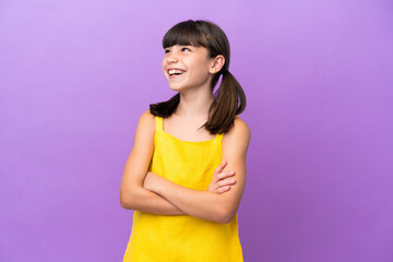 Little caucasian kid isolated on purple background happy and smiling