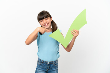 Little caucasian kid isolated on white background holding a check icon and pointing it