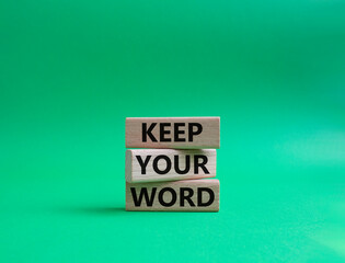 Keep your word symbol. Wooden blocks with words Keep your word. Beautiful green background. Business and Keep your word concept. Copy space.