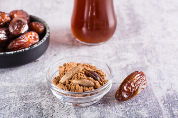 Bowl with date pit powder for making coffee on the table. Caffeine Free Alternative to Coffee
